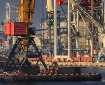 Lifting cargo cranes, ships and grain dryer in Sea Port of Odessa, Black Sea, Ukraine