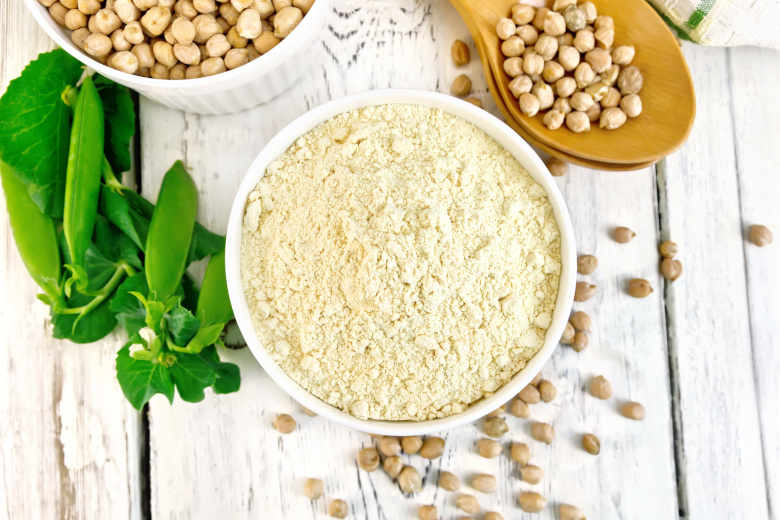 Flour chickpeas in bowl on board top