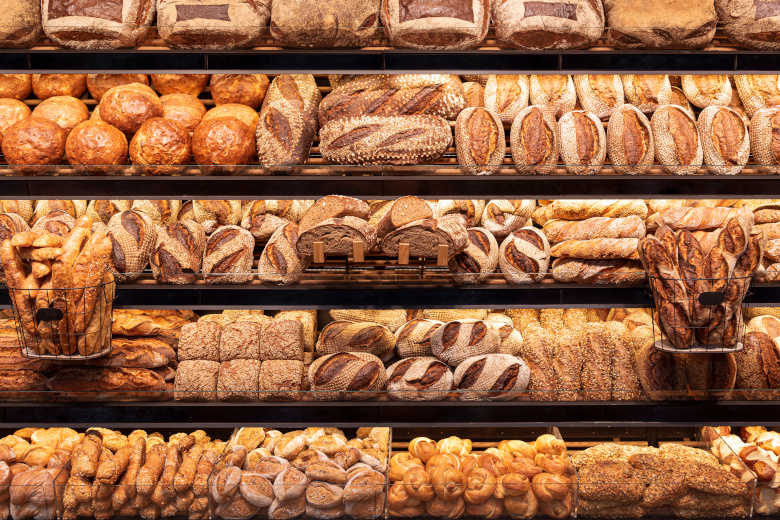 Bakery shelf with many types of bread. Tasty german bread loaves